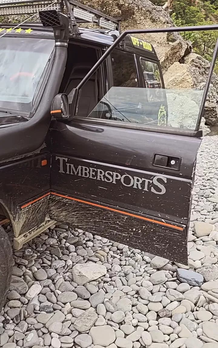 The 4x4 down on the gravel bank beside the river