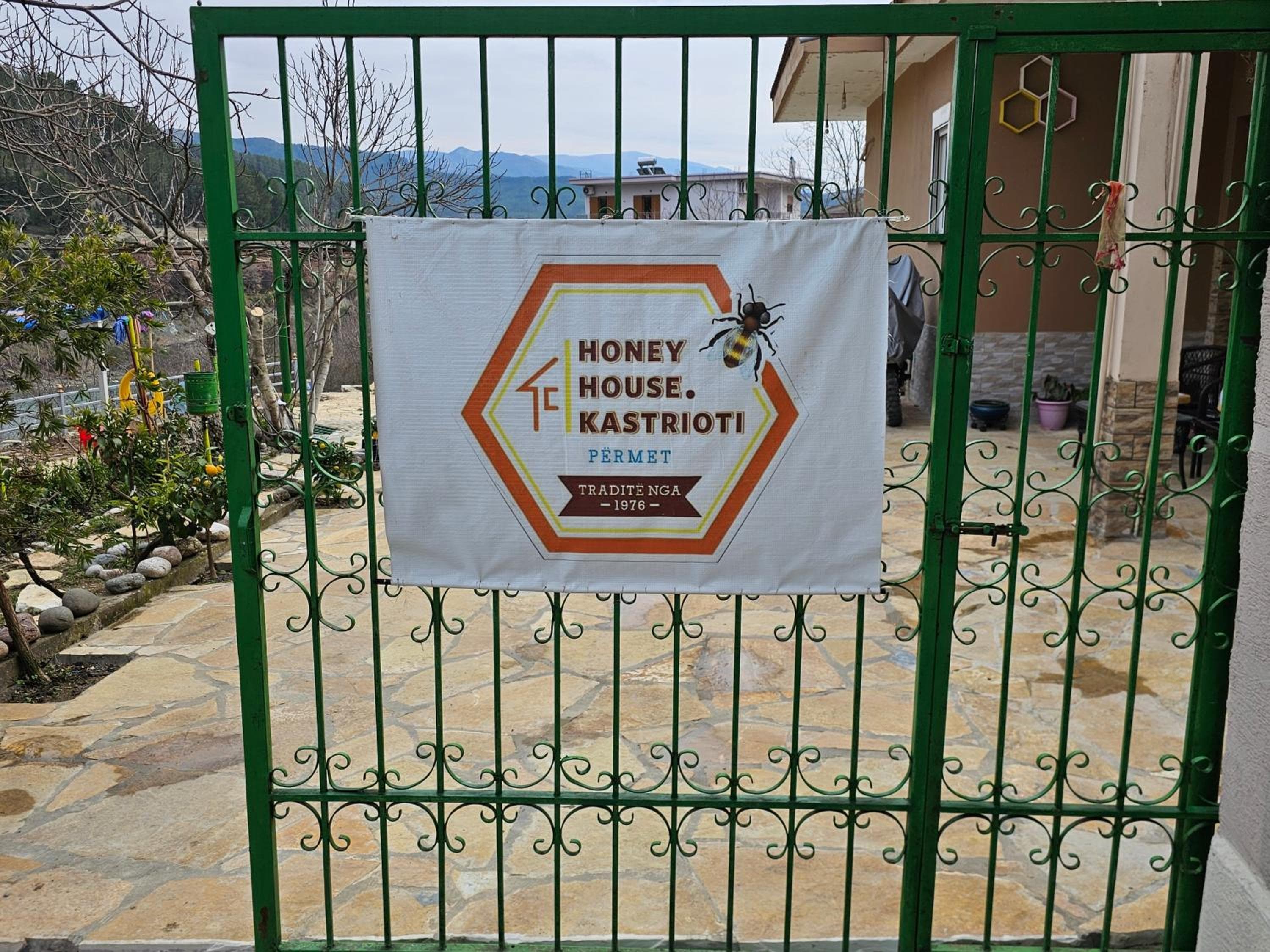 The Honey House Kastrioti sign on the guesthouse gate