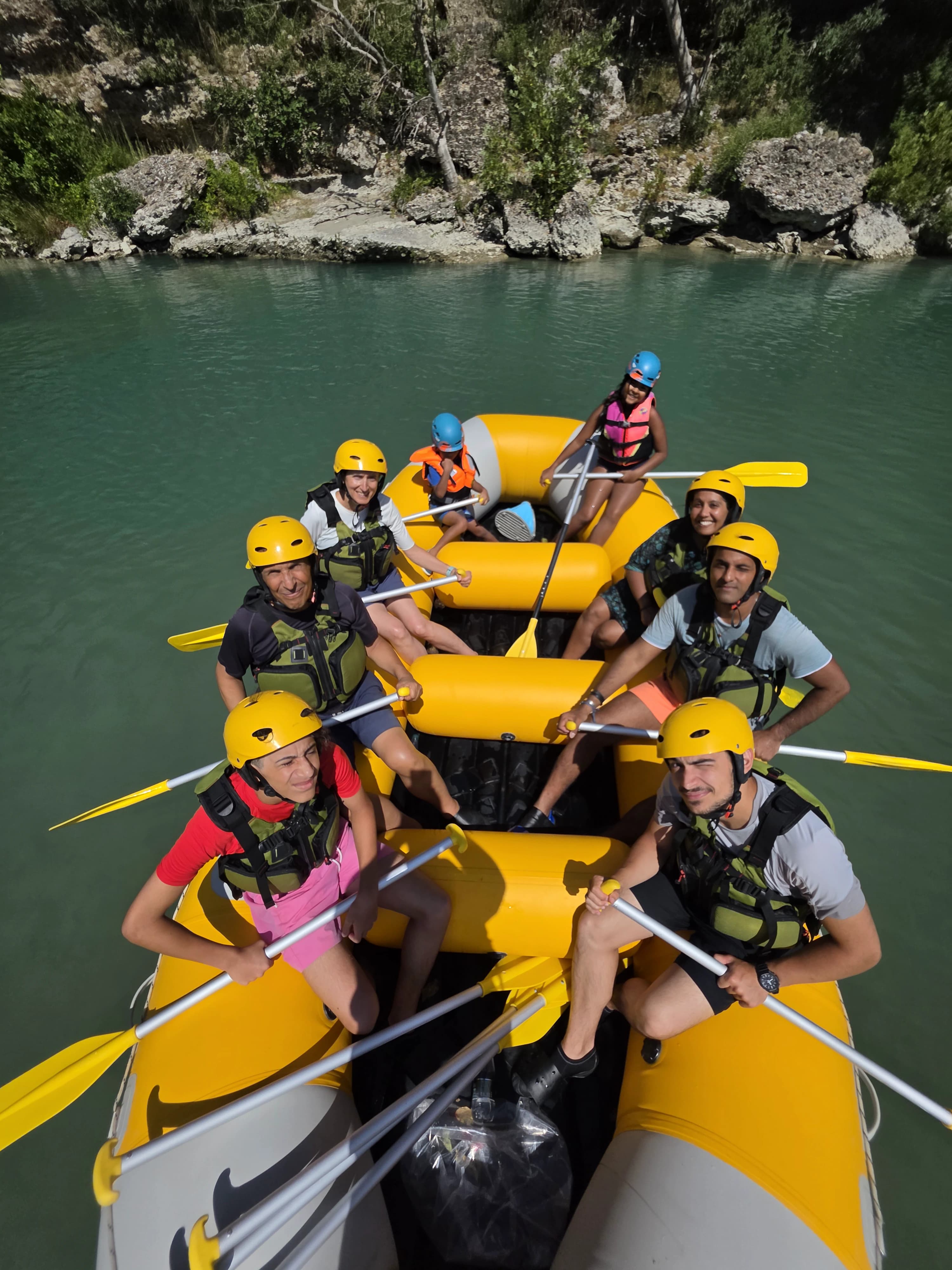 A raft on the turquoise Vjosa, from above